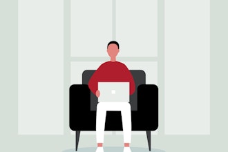 Mand sidder i lænestol med computer